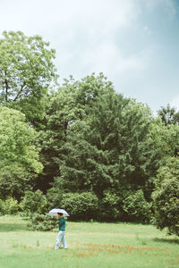 People walking on grassy field