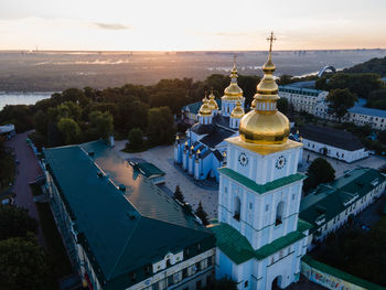 High angle view of lit buildings in city