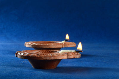 Close-up of cake on table against blue background