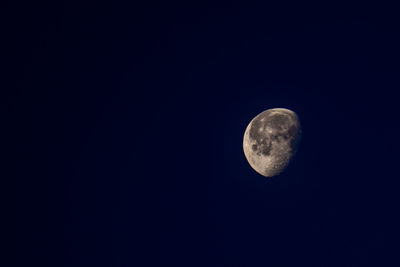 Low angle view of moon against sky at night