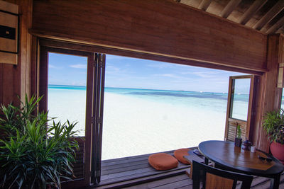 Scenic view of sea seen through window