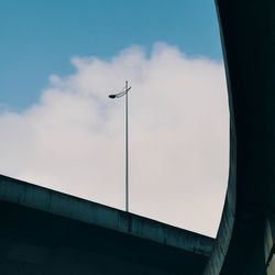 Low angle view of street light against sky