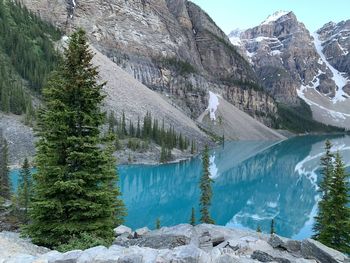 Scenic view of moraine lake by mountains