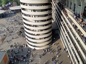 High angle view of people on street amidst buildings in city