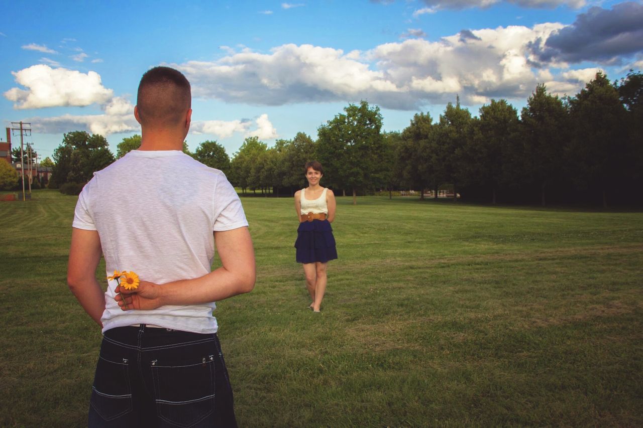 lifestyles, casual clothing, leisure activity, grass, sky, full length, childhood, standing, tree, person, boys, girls, field, cloud - sky, rear view, green color, elementary age, grassy