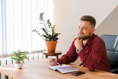 Planners scheduling calendar and agenda reminders, office work. bearded man