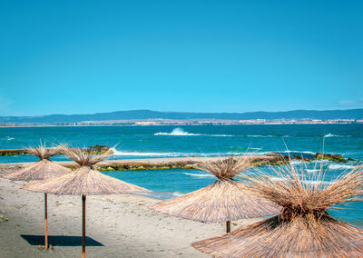 Scenic view of sea against clear blue sky