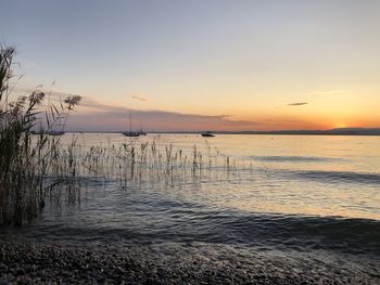 Scenic view of sea against sky during sunset