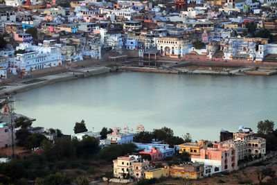 High angle view of lake amidst houses in pushkar