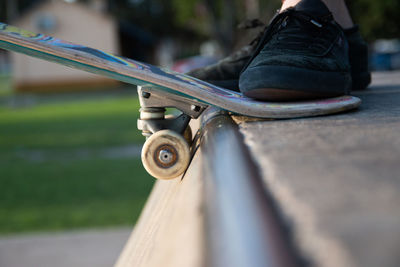 Close-up portrait of skateboarder standing in a ramp