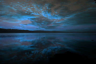 Scenic view of sea against sky at night