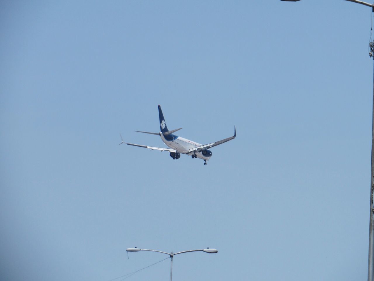 air vehicle, airplane, flying, transportation, mode of transport, mid-air, low angle view, on the move, clear sky, public transportation, travel, journey, helicopter, copy space, commercial airplane, airways, motion, sky, aircraft, blue