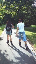 Full length of boy standing on footpath