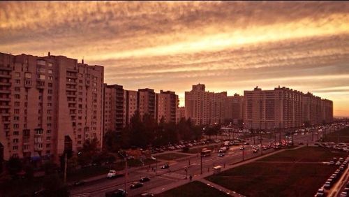 Cityscape against sky during sunset