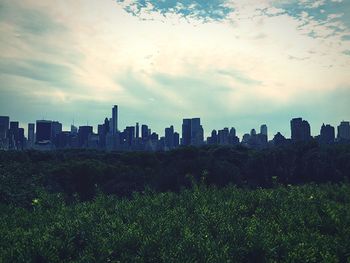 View of city against cloudy sky