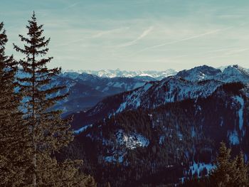 Scenic view of snow covered mountains against sky