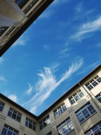 Low angle view of building against blue sky