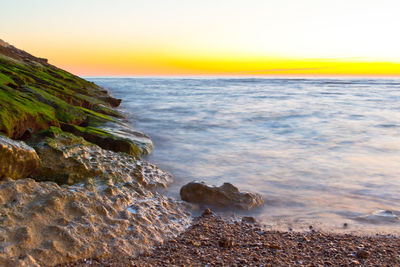 Scenic view of sea at sunset