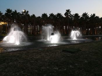 Scenic view of waterfall against sky