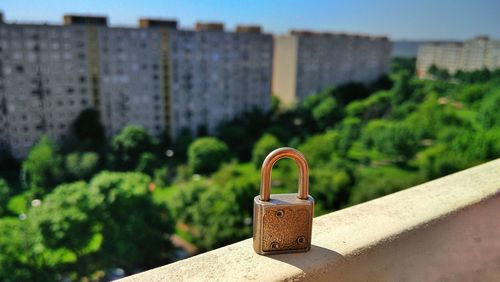 Close-up of padlock on retaining wall 