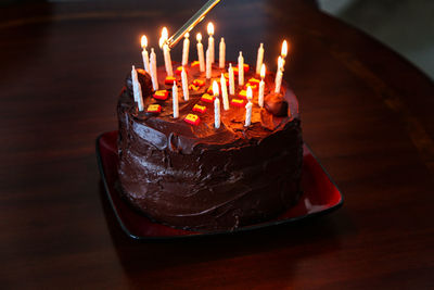 Lighting the candles of a birthday cake