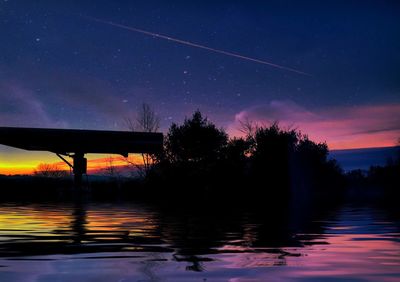 Reflection of clouds in water at sunset