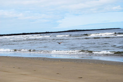 Scenic view of beach against sky