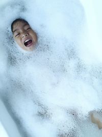 Portrait of boy in bathtub