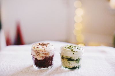 Close-up of dessert in containers on table