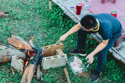 High angle view of man preparing food