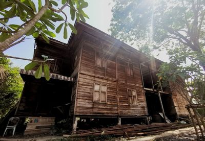 Low angle view of abandoned building against sky