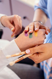 Close-up of woman holding hands