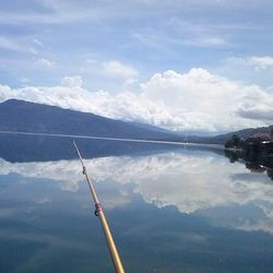 Scenic view of reflection of clouds in water