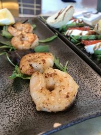 Close-up of served food in plate on table