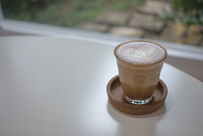 Close-up of coffee cup on table