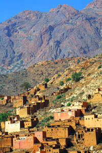 Low angle view of houses against mountain