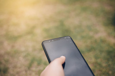 Close-up of person using mobile phone