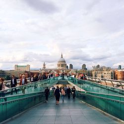 People at millennium bridge against st paul cathedral