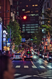 Traffic on city street at night