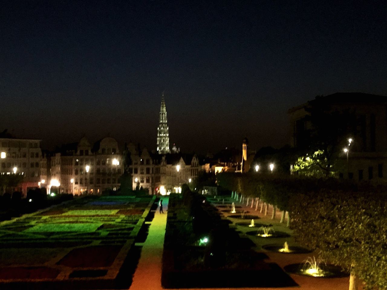 ILLUMINATED CITY AGAINST SKY