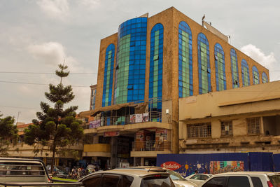 Low angle view of building in city against sky