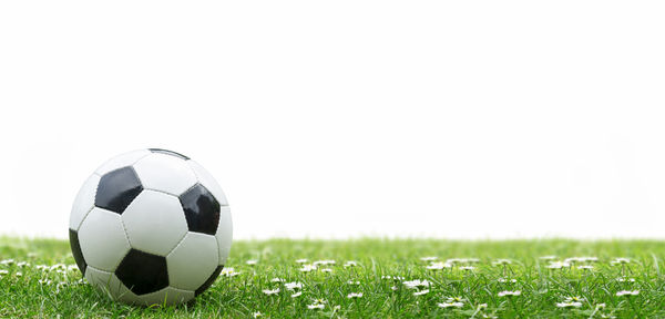 Close-up of soccer ball on field