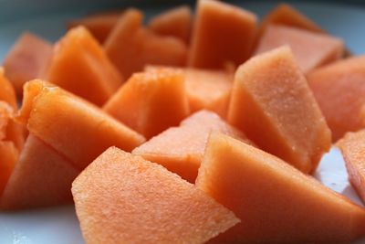 Close-up of chopped cantaloupes on table