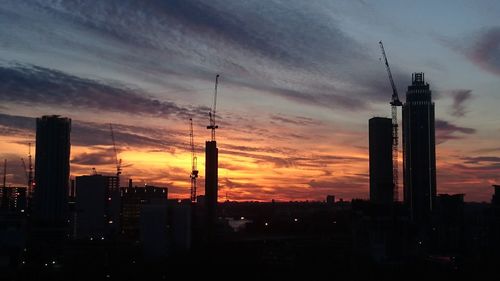 Silhouette of city at sunset