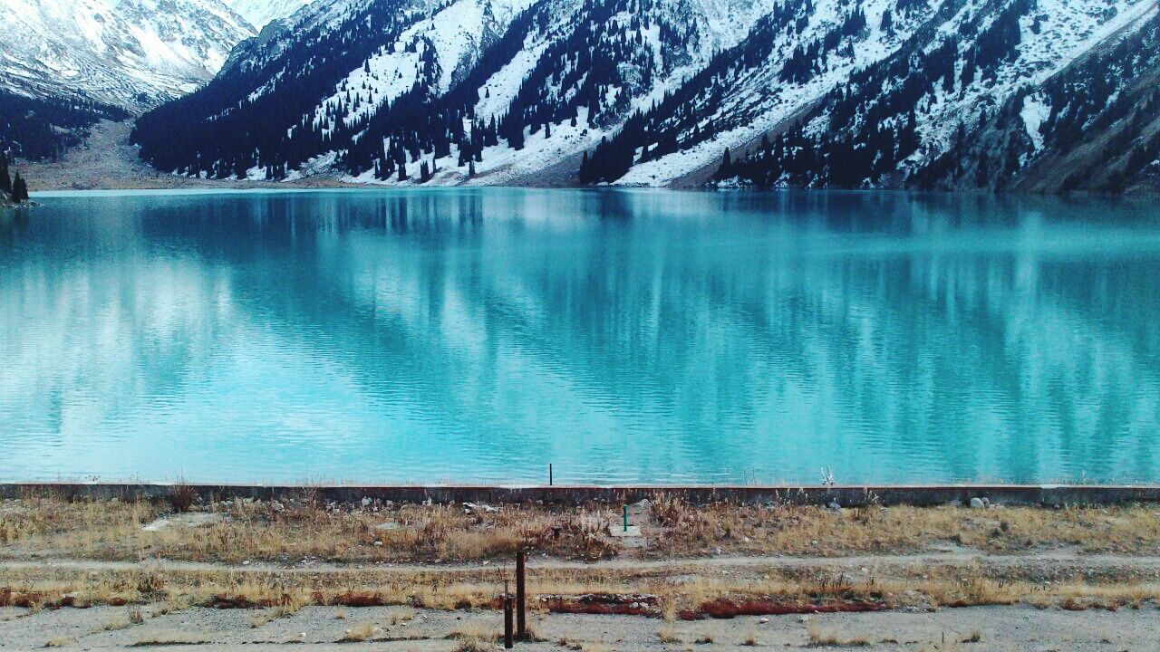 water, tranquil scene, tranquility, lake, mountain, blue, scenics, beauty in nature, reflection, nature, mountain range, idyllic, day, calm, non-urban scene, outdoors, no people, remote, rippled, landscape