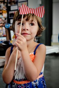 Close-up of girl holding decoration