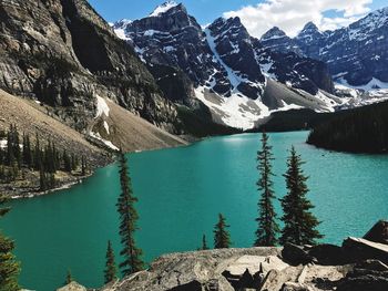 Scenic view of lake and snowcapped mountains