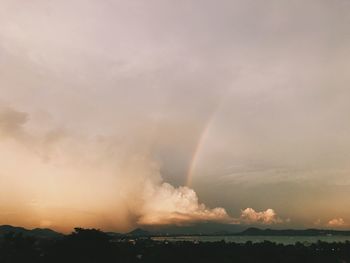 Scenic view of rainbow against sky during sunset