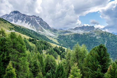 Scenic view of mountains against cloudy sky