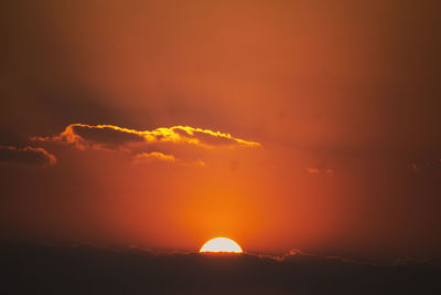 Scenic view of dramatic sky during sunset